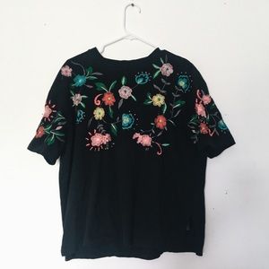 black shirt with floral embroidery